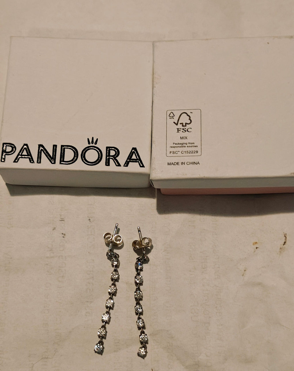 Genuine Pandora sparkling eight stones drop earrings. Sterling silver.