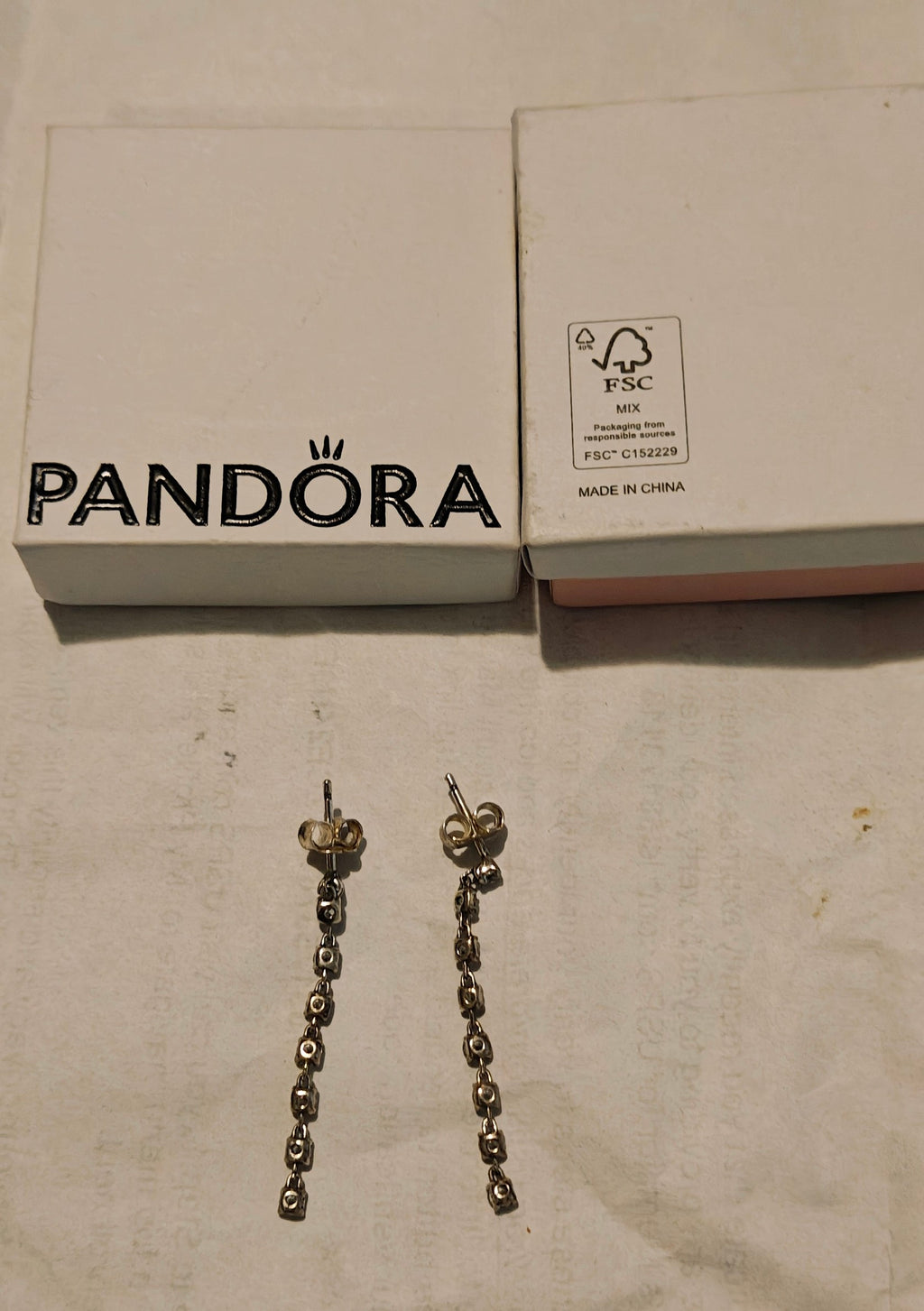 Genuine Pandora sparkling eight stones drop earrings. Sterling silver.